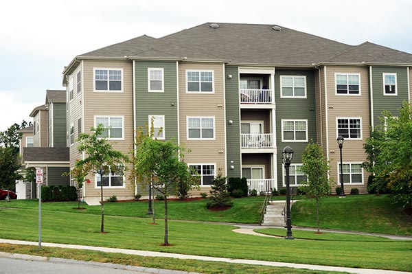 Managed apartment community with landscaped grounds